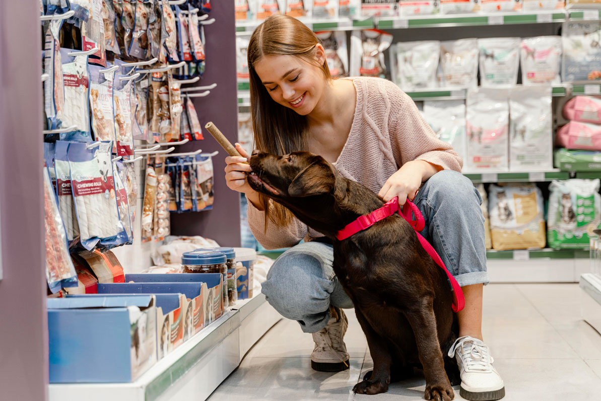 adorable-dog-with-owner-pet-shop(1)